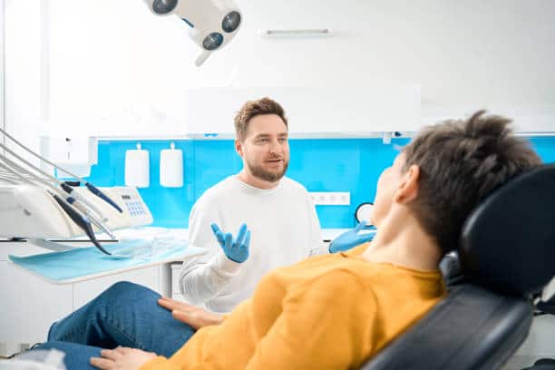 Dentist calmly explaining procedure