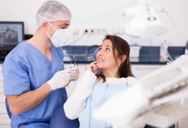 Dentist in New Farm helping patient choose dental filling type