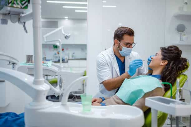 Dentist reassuring patient