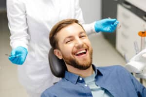 modern dental clinic, dentist and patient smiling